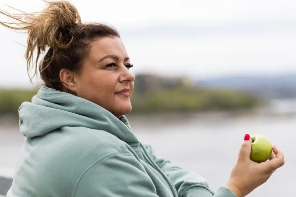 Woman eating apple